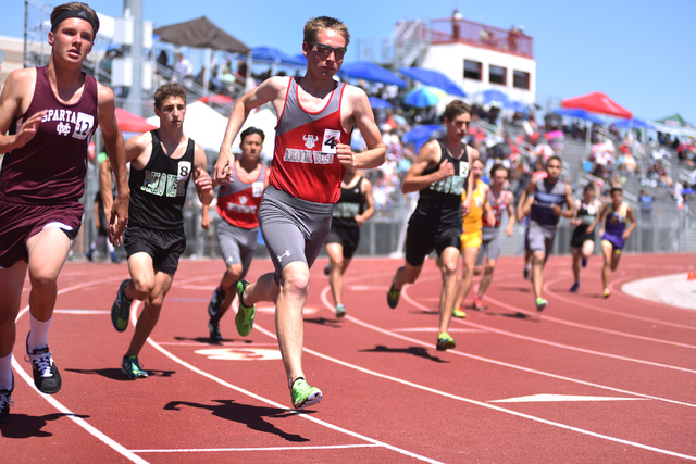 Boys compete in the 1600-meter run at the Sunset Region meet held at Del Sol High School in ...