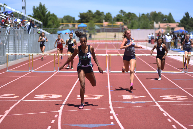 Palo Verde’s Jessica Fields, center, wins the 300-meter hurdles in the Sunset Region m ...