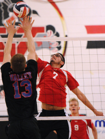 Las Vegas’ Guillermo Gonzales (7) spikes the ball over Valley’s Zack Ross (13) d ...