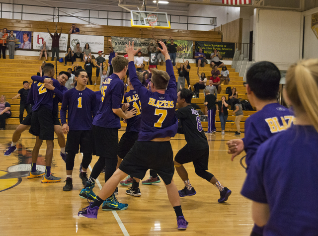 The Durango boys volleyball team celebrates after winning the Sunset Region boys volleyball ...