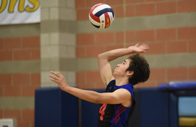 Valley’s Justin Sandoval (4) serves the ball against Green Valley during their volleyb ...