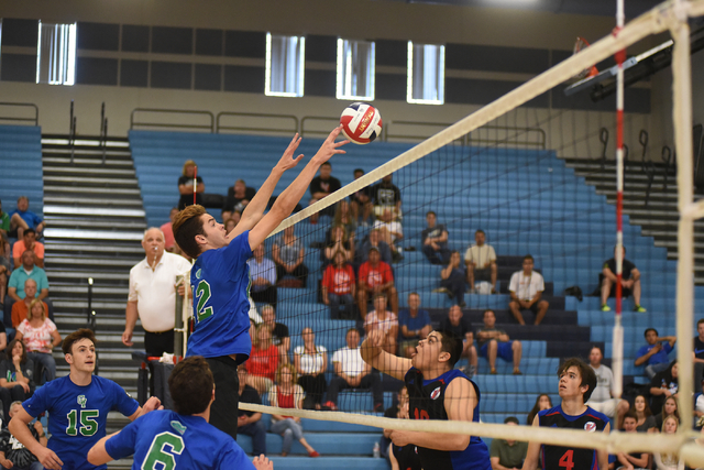Green Valley’s Chase Larson (12) taps the ball against Valley during their volleyball ...