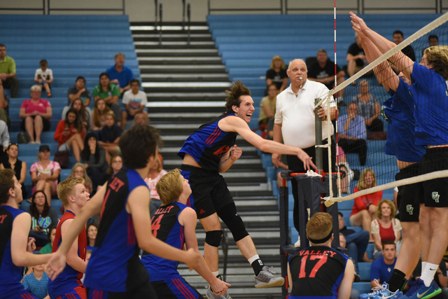 Valley’s Marty Heavey (18) spikes the ball against Green Valley during their volleybal ...