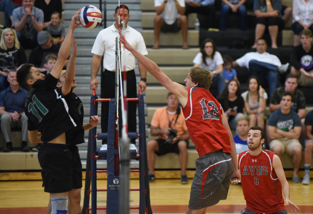Arbor View’s Brenden Wagner (12) spikes the ball against Palo Verde’s Taylor Mil ...