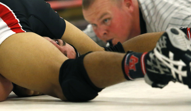 Coronado’s Gregory Watnem peaks between Las Vegas’s Aaron Najera legs while Naje ...