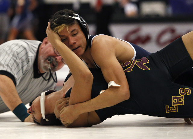 Canyon Spring’s Edwin Gutierrez, top, attempts to pin from Eldorado’s Anthony To ...