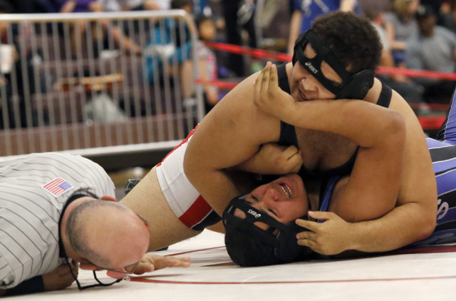 Las Vegas’s Robby Kaempfer, top, pins Basic’s Francisco Mendoza during a 285 pou ...