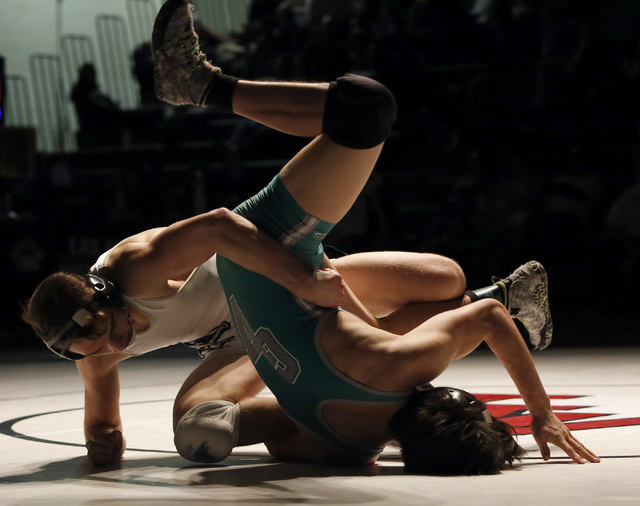 Foothill’s Wyatt English, left, wrestles Green Valley’s Desmond Bowers during a ...