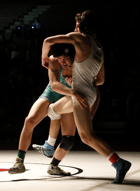 Green Valley’s Desmond Bowers, left, shoots on Foothill’s Wyatt English during a ...