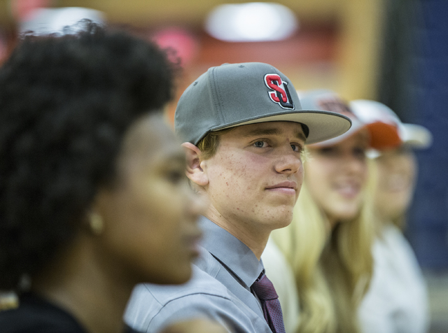 Bishop Gorman baseball player Jarrod Billig sits with fellow student athletes expected to si ...