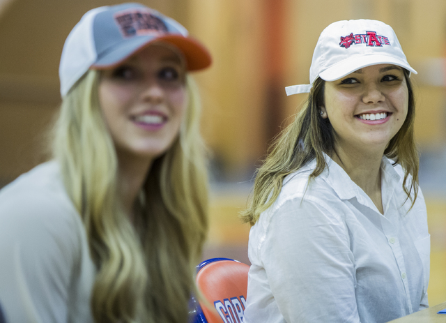 Bishop Gorman’s Leah Glaser, right, sits with fellow student athletes expected to sign ...