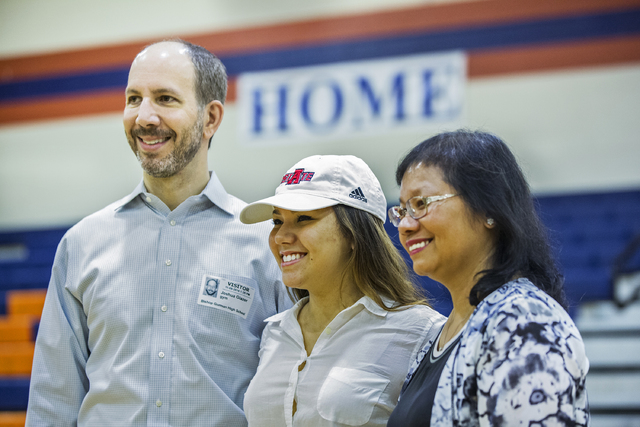 Bishop Gorman’s Leah Glaser, middle, pose for a photo with parents Joshua and Irene Gl ...