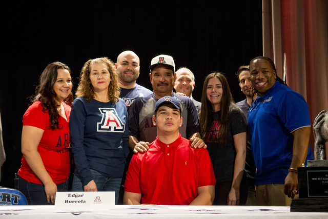 Senior Edgar Burrola poses with his family and friends after signing to play football for Un ...
