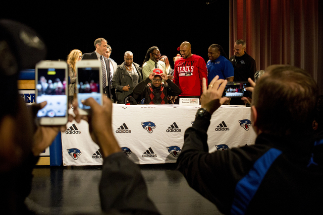 Senior Marckell Grayson signs to play college football for UNLV at Desert Pines High School, ...