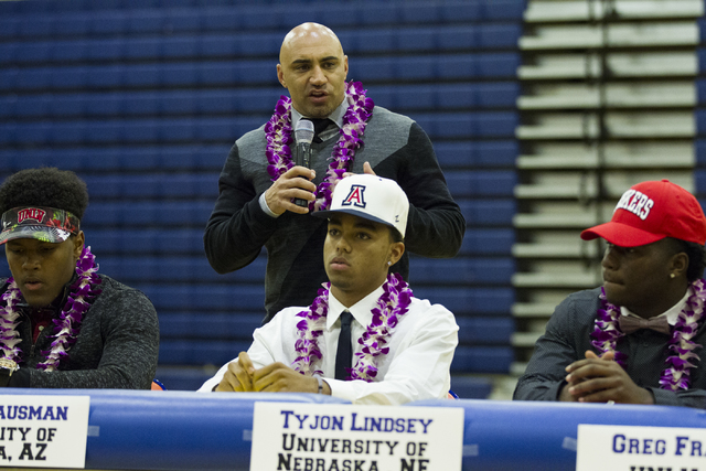 Bishop Gorman football head coach Kenny Sanchez speaks during Signing Day, with his players ...