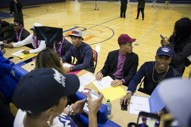 Bishop Gorman athletes are photographed by friends and family during Signing Day at Bishop G ...