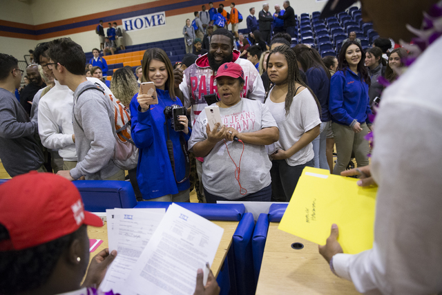 Bishop Gorman football players are photographed by family and friends during Signing Day at ...
