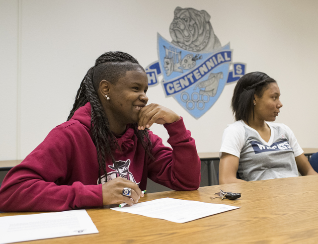 Pam Wilmore, left, Samantha Thomas wait to sign their letters of intent at Centennial High S ...