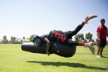 Tyrell Brooks, 16, tackles a football dummy during a team practice at Mountain View Christi ...