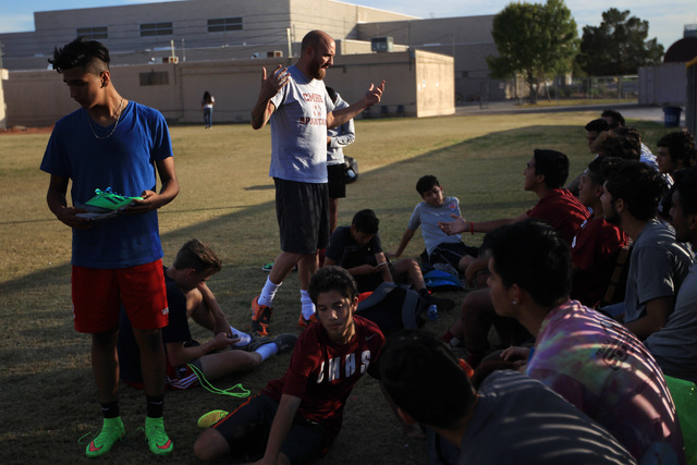 Cimarron Memorial soccer coach Mark Bailey talks to his team after practice Wednesday. (Sam ...