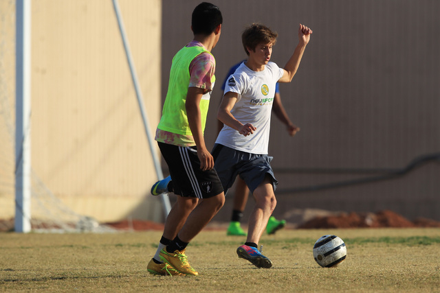 Cimarron-Memorial soccer player Garrick Quackenbush dribbles during practice Wednesday. (Sam ...