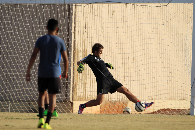 Cimarron-Memorial soccer goalkeeper Richard Crews stops a shot during practice Wednesday. (S ...