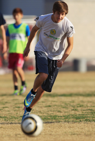 Cimarron-Memorial soccer player Garrick Quackenbush chases down a ball during practice Wedne ...