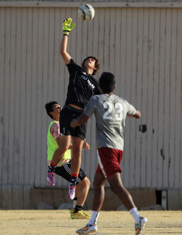 Cimarron-Memorial soccer goalkeeper Richard Crews stops a shot during practice Wednesday. (S ...