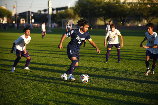 Centennial’s Manny Lopez (10) dribbles the ball against Durango’s defense during ...