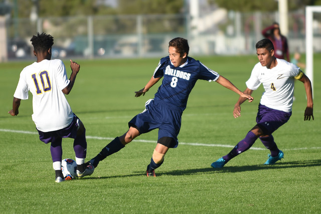 Centennial’s Jacob Garcia (8) battles for the ball against Durango’s Marcos Delg ...