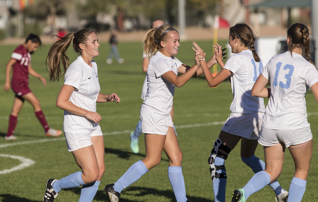 Foothill’s Elise Bush (7) celebrates with teammates after scoring a goal during the Su ...