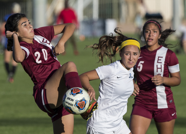 Eldorado’s Leilani Aguilar 20) and Rosario Hernandez (5) fight for ball with Foothill& ...