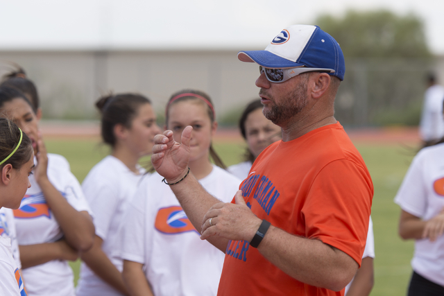 Coach Doug Borgel speaks with the girls soccer teams during practice at Bishop Gorman High S ...