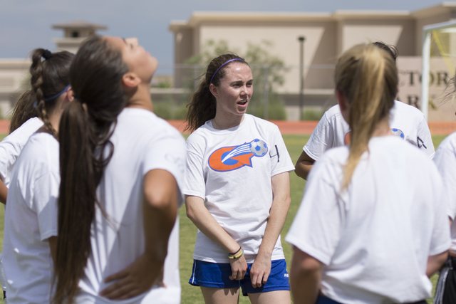Hannah Borgel (24), center, takes a rest during girls soccer practice at Bishop Gorman High ...