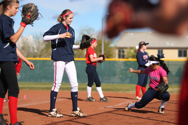 Sarah Pinkston, 16, second from left, pitcher for Coronado’s varsity softball team, ge ...