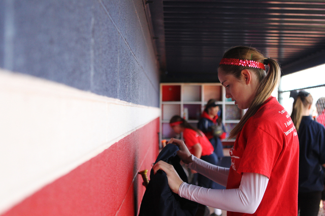 Sarah Pinkston, 16, pitcher for Coronado’s varsity softball team, gets ready for a tea ...