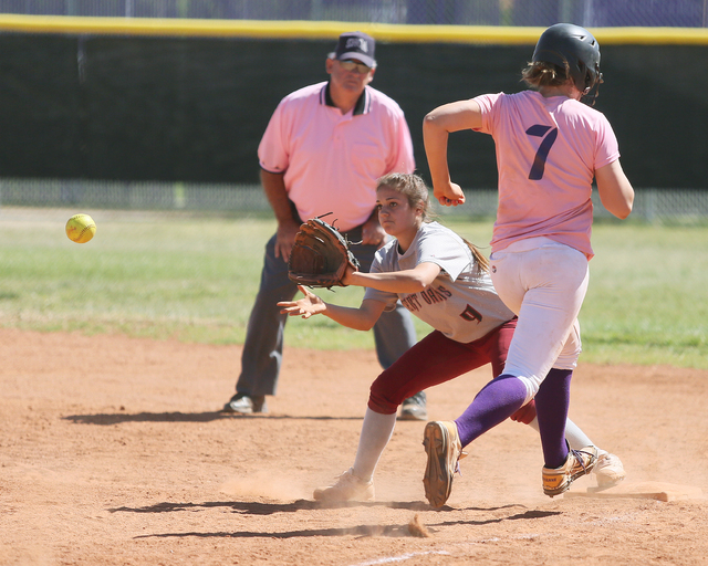 Desert Oasis’ Sammantha Caruso prepares to record an out against Durango’s Cheya ...