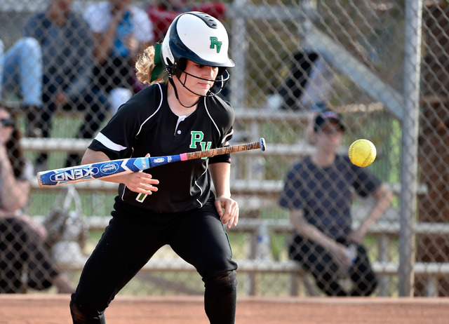 Palo Verde Jordan Menke bunts the ball against Centennial during a high school softball game ...