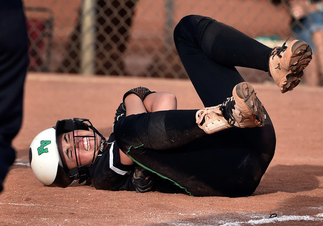 Palo Verde’s Cara Beatty grimaces after hitting the ball against Centennial during a h ...