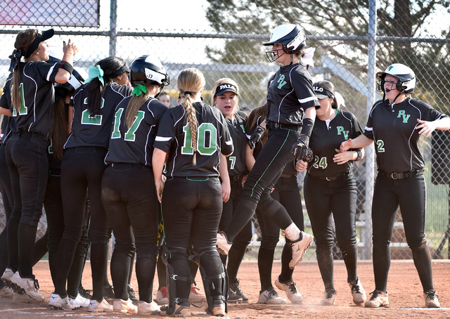 Palo Verde’s Cara Beatty, 3rd right, jumps on home plate with her teammates celebratin ...