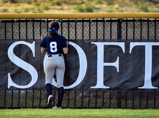 Centennial center fielder Angel Love watches the ball fly over the outfield fence after the ...