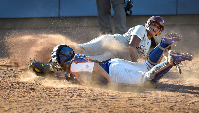 Faith Lutheran’s Cheyenne Kidd slides safely into home plate against Bishop Gorman cat ...