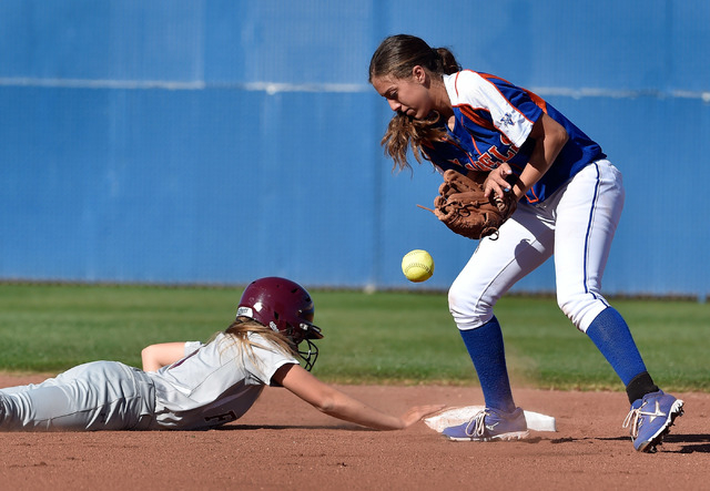 Faith Lutheran’s Makena Martin, left, beats the tag at second base against Bishop Gorm ...