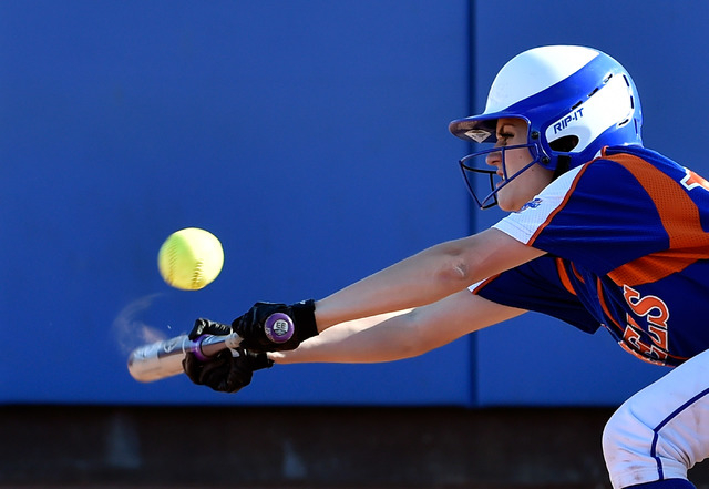 Bishop Gorman’s Morgan Blanner punts the ball during a high school softball game again ...