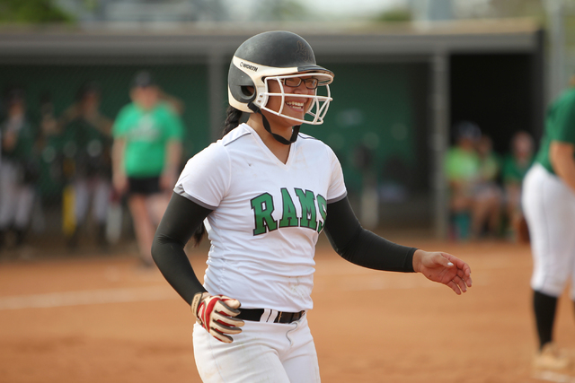 Rancho’s Tiare Lee (22) smiles as she runs to first base after a walk in their softbal ...