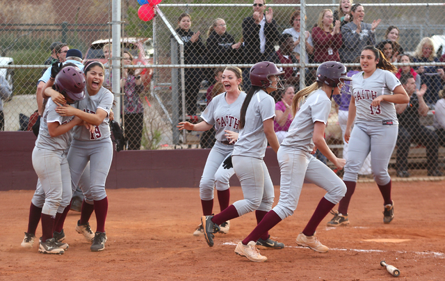 Faith Lutheran players celebrate their 6-5 win over Boulder City on Thursday. (Chase Stevens ...