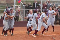 Faith Lutheran players celebrate their 6-5 win over Boulder City on Thursday. (Chase Stevens ...