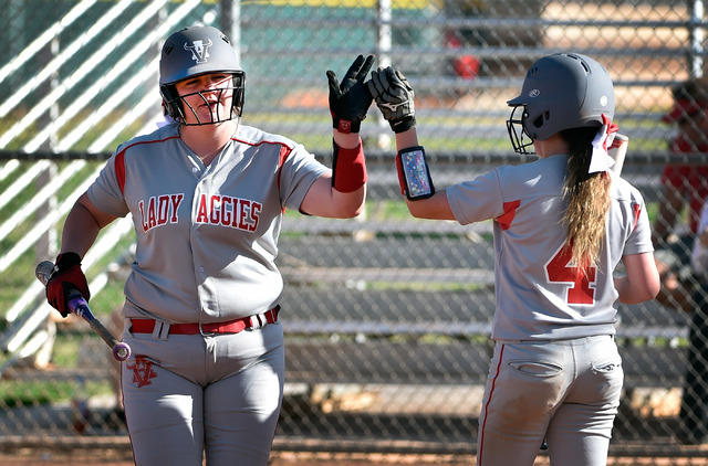 Arbor View’s Marissa Bachman gets a high-five from Breanne Henricksen (4) after Bachma ...