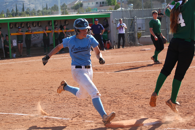 Centennial’s Heather Bowen runs safely to first base as Palo Verde’s Rachael Tur ...