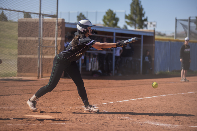 Palo Verde High School’s Cara Beatty (5) bunts at a pitch against Centennial High Scho ...